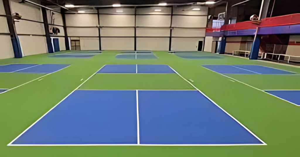 Indoor pickleball court with synthetic sports flooring and standard markings