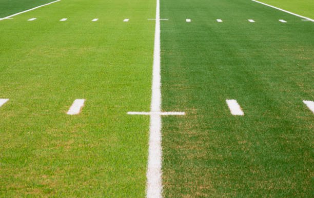 Close-up view of artificial football turf grass surface