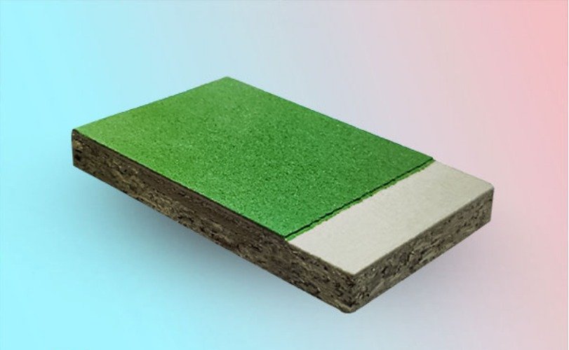 Cross-section of synthetic acrylic sports flooring showing base layer and green top surface