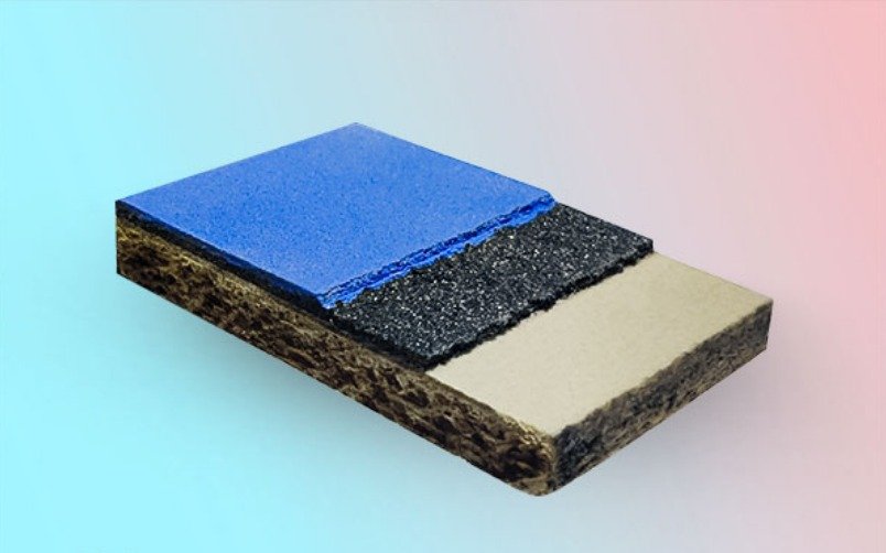 Layered structure of acrylic sports flooring with base, cushion layer, and blue top surface
