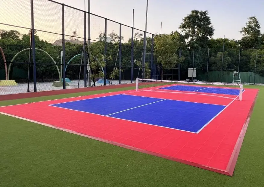 Professional pickleball court construction with PP interlocking tiles and sports fencing by YNextGen Sports Infra