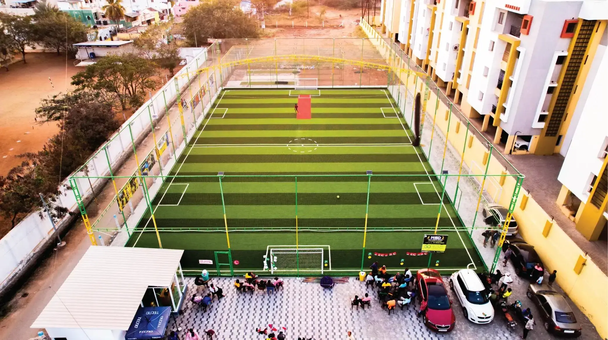 Professional football turf construction with artificial grass and fencing by YNextGen Sports Infra in India