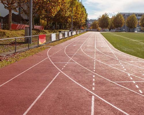 PU sandwich system athletic running track with red synthetic surface for professional sports stadium