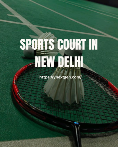 Badminton sports court in New Delhi with racket and shuttlecock placed on green indoor court surface