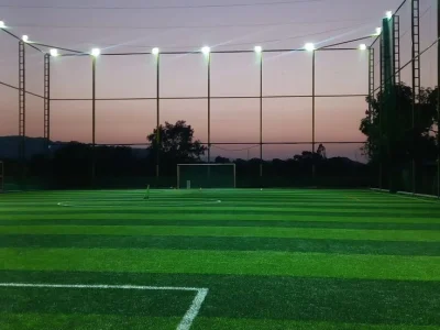 Professional football synthetic turf ground with artificial grass and LED floodlights in India