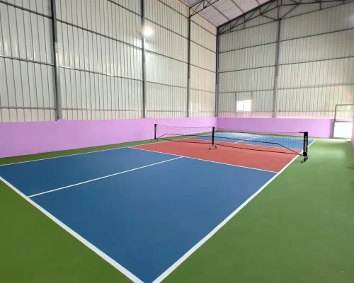 Indoor pickleball court with acrylic sports flooring and professional court markings