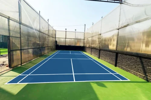 Synthetic tennis court flooring in Dehradun with blue hard court surface designed for durability, anti-slip grip, and professional performance by Y NextGen Private Limited