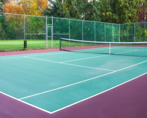 Outdoor tennis court construction with acrylic sports flooring and professional court markings