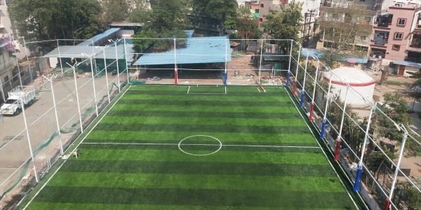 Aerial view of a professional football turf with artificial grass and field markings