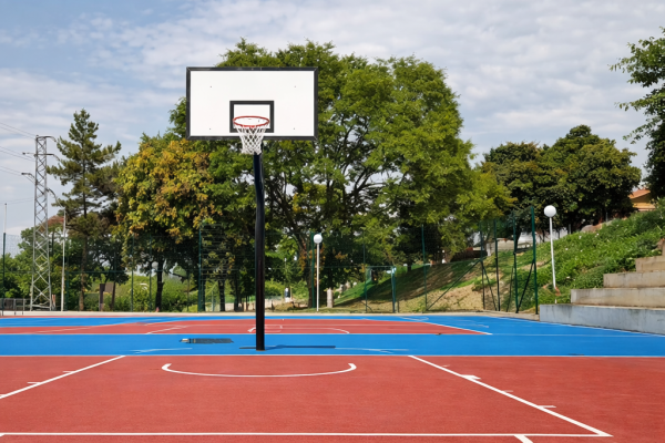 Outdoor PU basketball court with red and blue surface and hoop