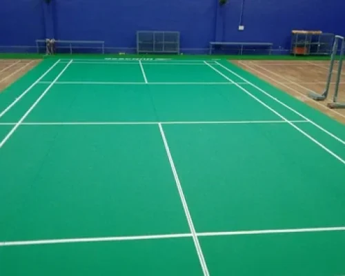 Synthetic badminton court flooring in Dehradun with green surface and professional court markings designed for durability, anti-slip grip, and high performance by Y NextGen Private Limited