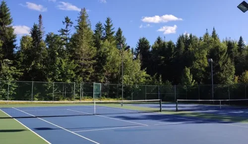 Tennis court flooring in Dehradun Uttarakhand by YNextGen Sports Infra with acrylic surface for professional play