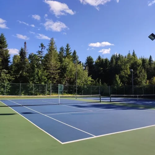 Tennis court flooring in Dehradun Uttarakhand by YNextGen Sports Infra with acrylic surface for professional play